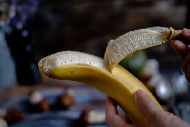 peeling banana stock photo