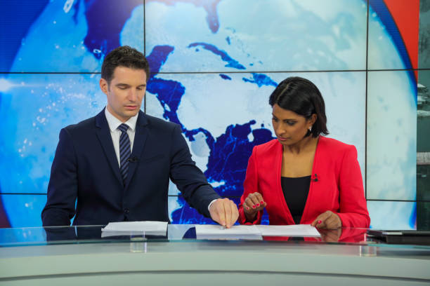 istock Journalists preparing in a tv news studio 1333143124
