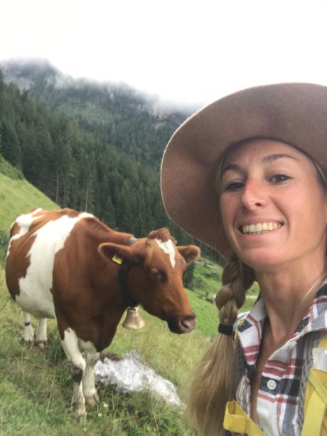 istock Woman takes selfie with a cow 1333143136