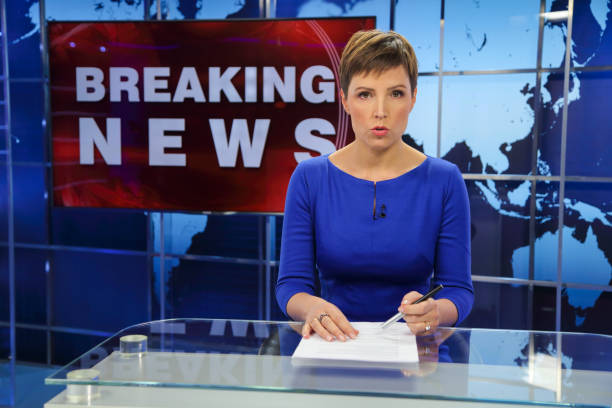 istock Breaking news female anchor 1333143138