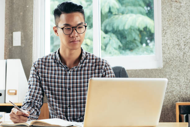 istock Smiling Young Businessman in Glasses 1333144190