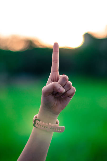 istock Raise up one fingers outdoors 1333144935