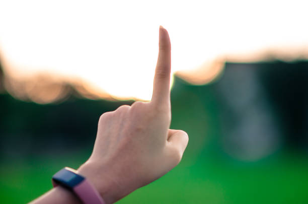 istock Raise up one fingers outdoors 1333144947