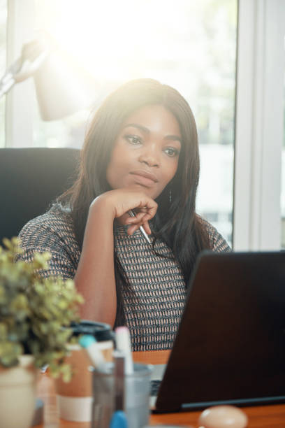 istock Businesswoman Reading Important Report 1333146356