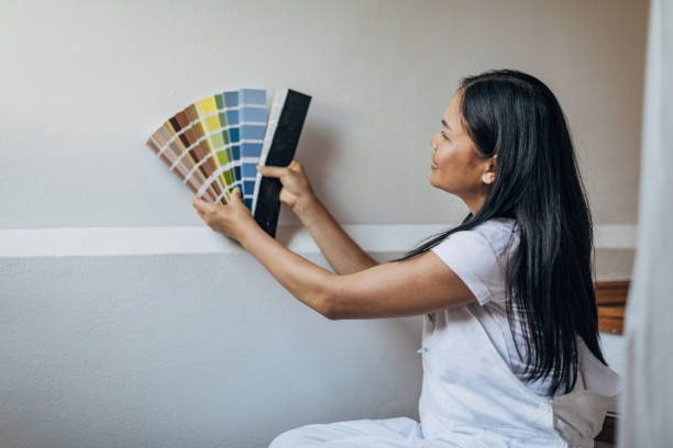 istock Woman choosing colors for walls 1333149199