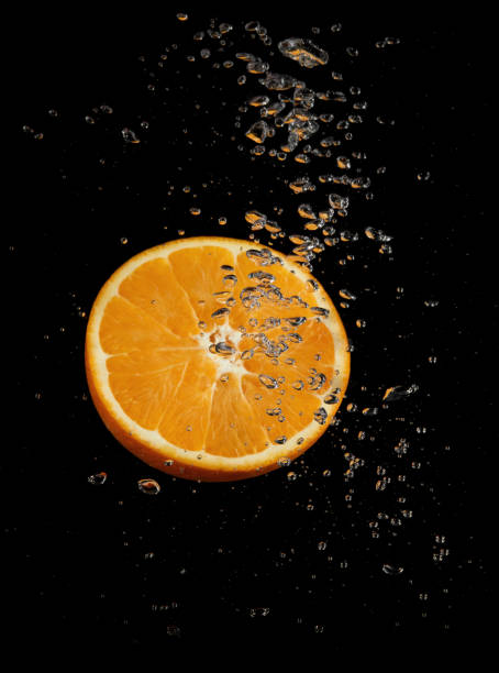 istock Orange splashing in water 1333151121