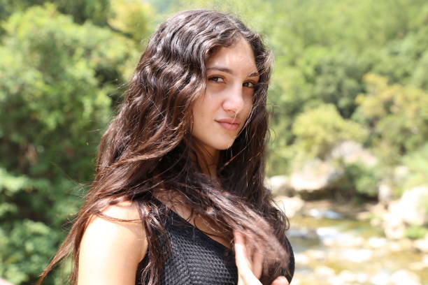 Woman enjoying the river, perfectly blending in with nature, perfect waist to hip ratio,