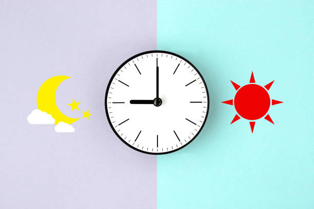 Clock with sun and moon clipping art on puple and light blue background