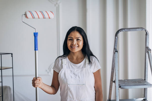 istock Portrait of a woman with paint roller 1333152803