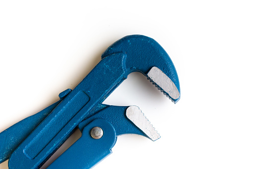 Gas key close-up on a white background. Blue gas key. A new adjustable wrench.