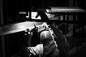 Welding steel pipe with Mig-Mag method for industrial work. Black & White concept