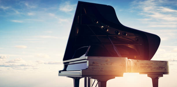 istock Grand piano on sunset sky background 1333157658