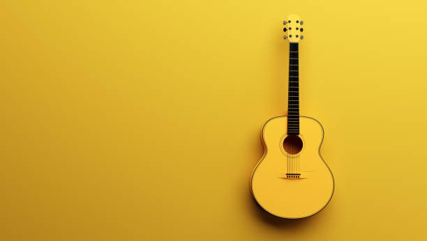 istock Classical acoustic guitar on yellow background. 1333158271