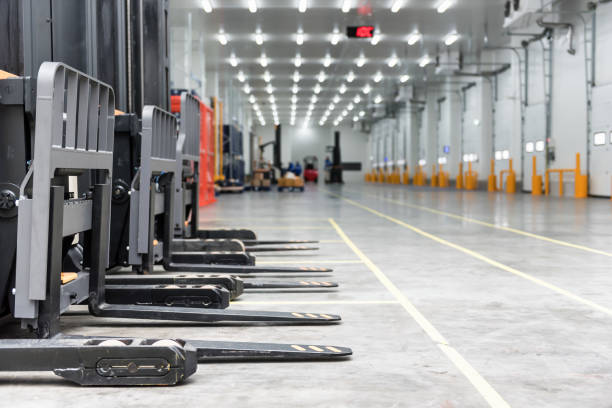 Loading area in the warehouse cold room  with forklift standing Loading area in the warehouse cold room  with forklift standing forklift photos stock pictures, royalty-free photos & images