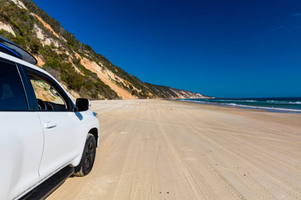 istock Off road vehicle on a colourful pristine beach 1333160626