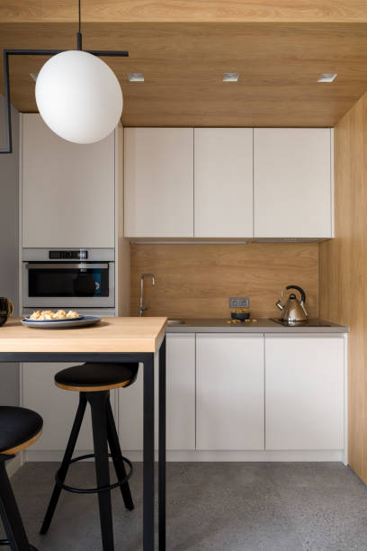 istock Stylish kitchen with wooden walls and ceiling 1333162382