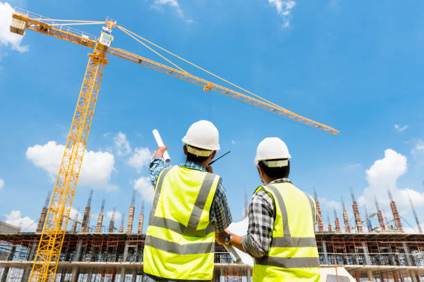 istock Civil engineer checking work with walkie-talkie for control and management in the construction site or building site of highrise building 1333165157