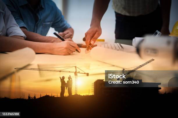 Civil Engineer Jobs Double Exposure Of Project Management Team And Construction Site With Tower Crane Background Day And Night Shift On Employees Job Concept Stock Photo - Download Image Now