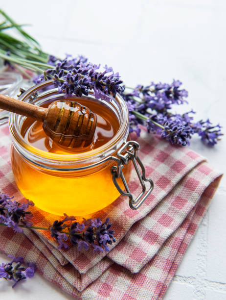 istock Jar with honey and fresh lavender flowers 1333165758