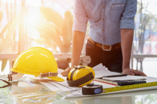 istock Engineer Designer People Drawing and Planning with Blueprint Architecture on Desk office. Drafting and Design Worksheets Before Startup Project Concept. 1333167588