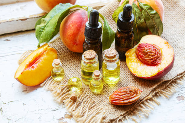 istock Peach seed oil in a bottle. Selective focus. 1333169667