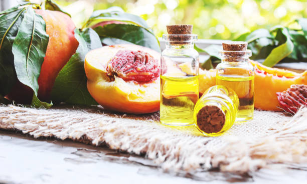 istock Peach seed oil in a bottle. Selective focus. 1333169689