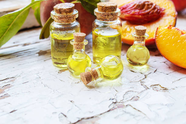 istock Peach seed oil in a bottle. Selective focus. 1333169694
