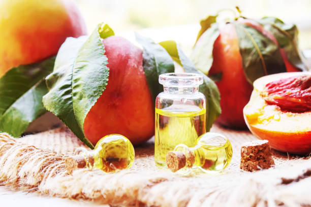 istock Peach seed oil in a bottle. Selective focus. 1333169695