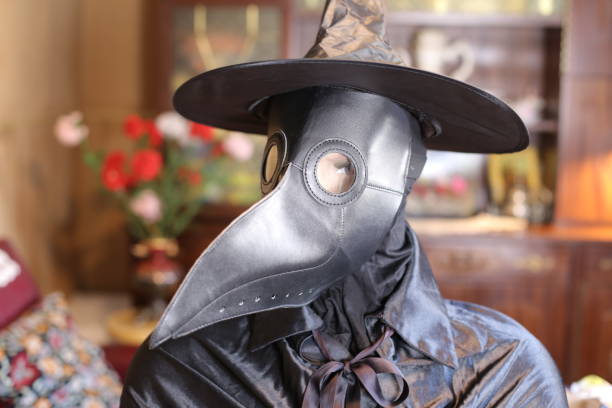 Plague doctor in spooky setting Plague doctor in spooky setting. black plague doctor stock pictures, royalty-free photos & images