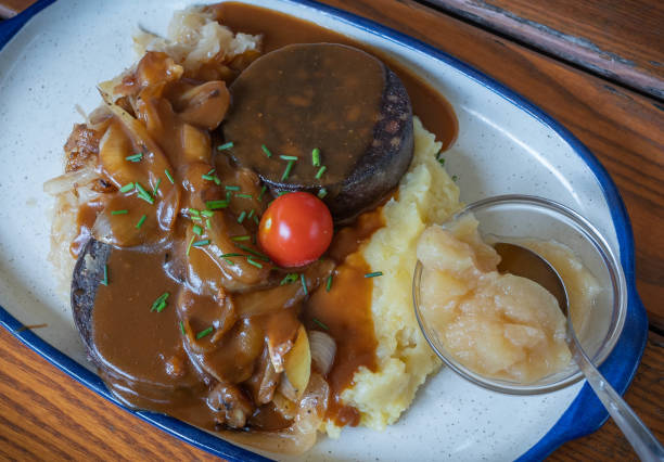 istock blood sausage with mashed potatoes, stewed cabbage and apples - a traditional dish in Germany 1333173423