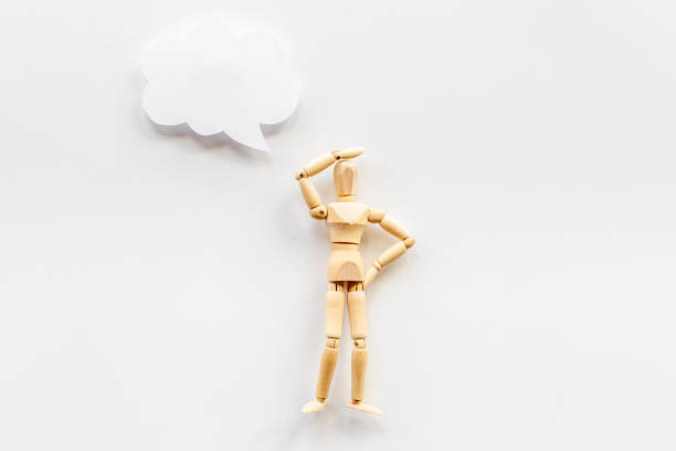 istock Idea concept. Wooden man figure with speech bubble banner 1333173605