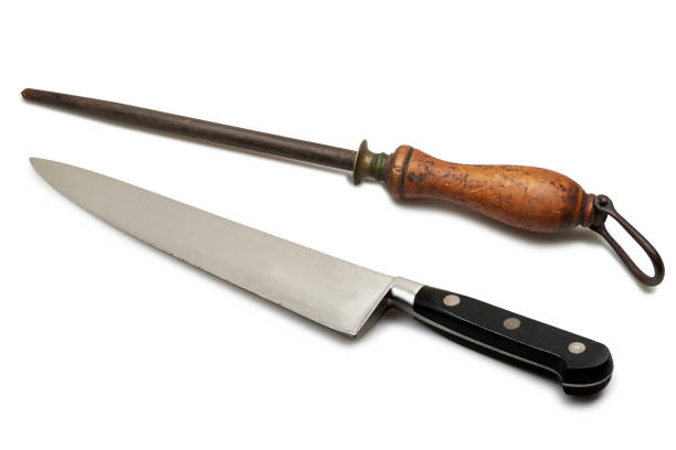Sharpening a knife in the Japanese fashion. The Japanese traditionally use natural sharpening stones lubricated with water when sharpening knives.