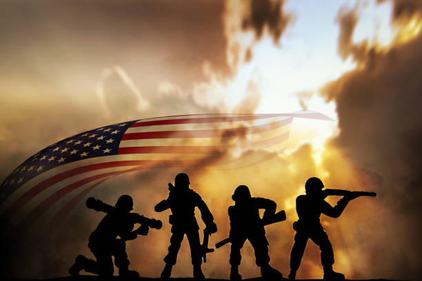 istock Silhouette of infantry on sky background. Veterans Day Concept 1333175106