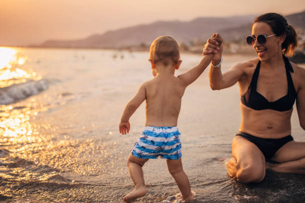 istock Mother and son having fun on vacation 1333175394