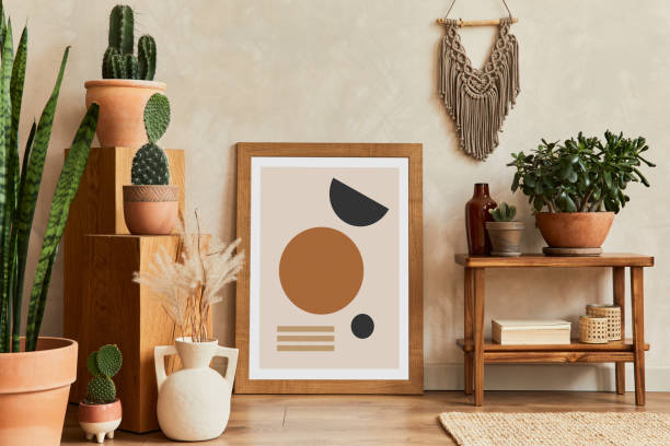 istock Creative composition of stylish living room interior with mock up poster frame, cacti and personal boho accessories. Plant love and nature concept. Template. 1333175689