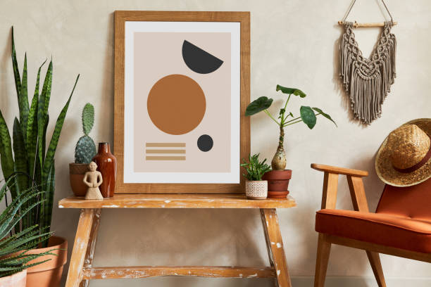 istock Creative composition of stylish living room interior with mock up poster frame, cacti and personal boho accessories. Plant love and nature concept. Template. 1333175735