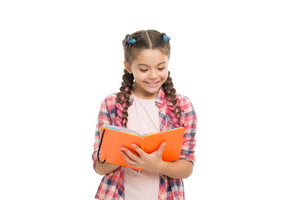 istock Interesting story. Achieve knowledge. Education concept. Cute small child holding book. Adorable little girl with school exercise book. Preparing activity book writing. Reading skills. Study language 1333177499