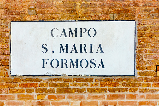 signage campo S. Maria Formosa - engl: square of holy adorable Mary - in Venice  at an old grunge house wall. Campo Santa Maria Formosa is a city square in Venice, Italy.