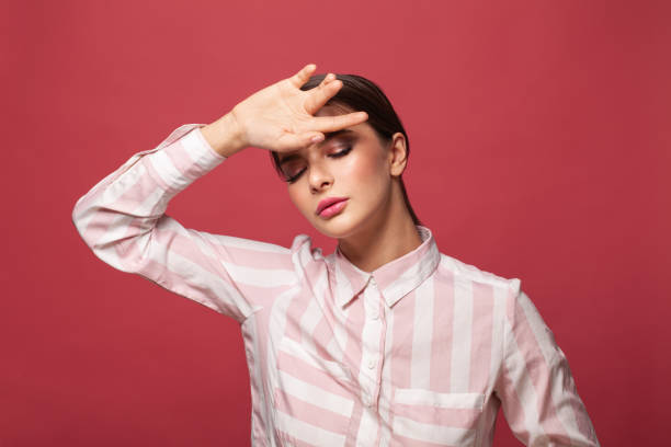 istock Brunette woman holding her hand with her head, depression headache problems migraine 1333183133