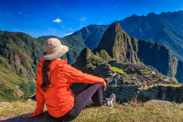 istock Young woman looking at Machu Picchu, Peru 1333184324