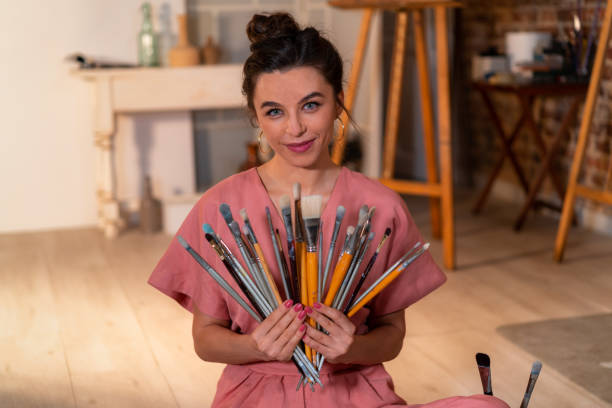 istock painting teacher with many brushes 1333184549