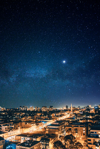 The bustle of the outskirts of the city paired with the glistening, magical sight of stars in the night sky.