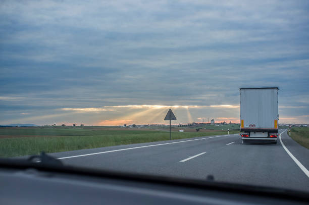 istock Driving behind  refrigerator truck or chiller lorry at sunset 1333185531