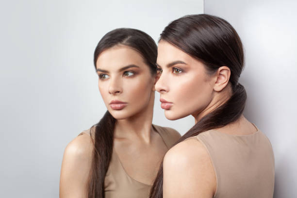 istock Anxious woman and self-image mirror on white background 1333185935