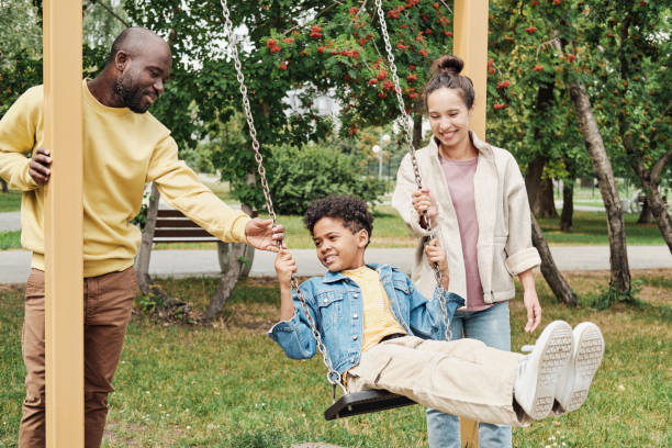 istock Family walking in the park 1333190540