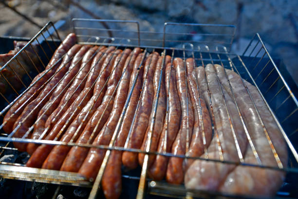 Grilled sausages and meat, barbecue grilled on coals.