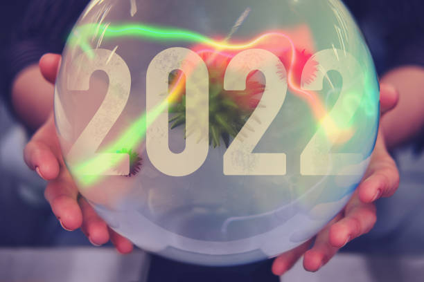 istock Forecast and fortune-telling about coronavirus on a crystal magic ball in 2022. The problem with the covid epidemic and vaccination against the virus 1333194560
