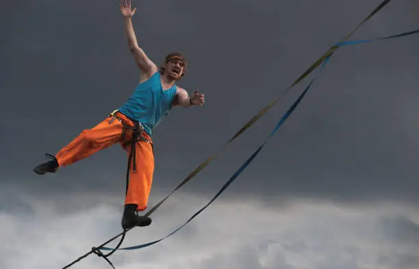 Emotional highliner tightrope walker close up.