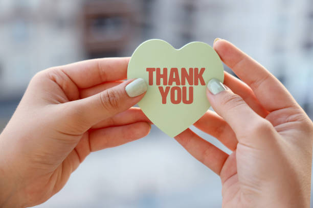 istock Women holding Thank You note with heart shape 1333197355