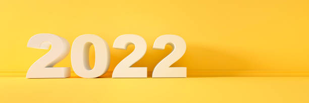istock Year 2022 Numbers in front of yellow wall 1333198371